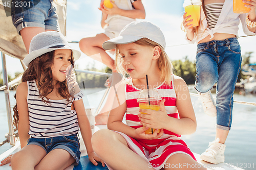 Image of The children on board of sea yacht