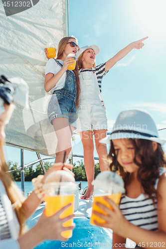 Image of The children on board of sea yacht