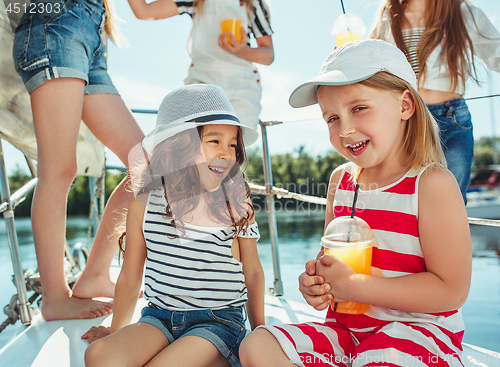 Image of The children on board of sea yacht