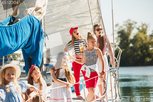 Image of The children on board of sea yacht