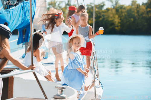 Image of The children on board of sea yacht