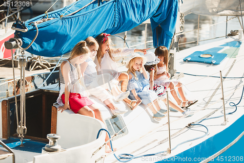 Image of The children on board of sea yacht