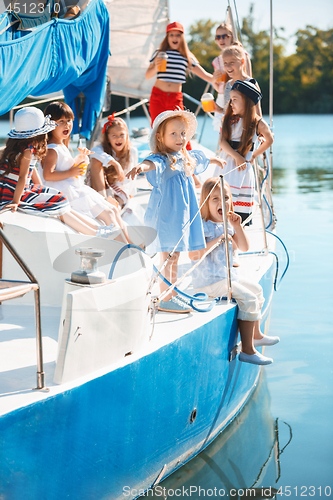 Image of The children on board of sea yacht