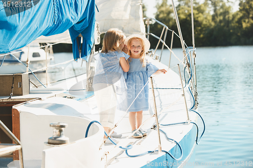 Image of The children on board of sea yacht