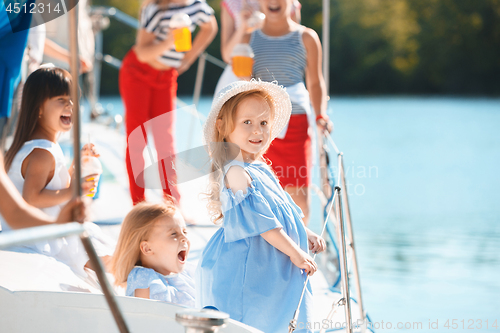 Image of The children on board of sea yacht