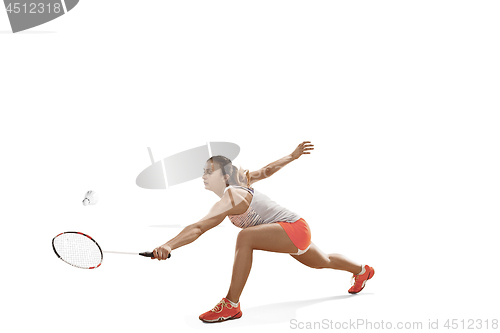 Image of Young woman playing badminton over white background