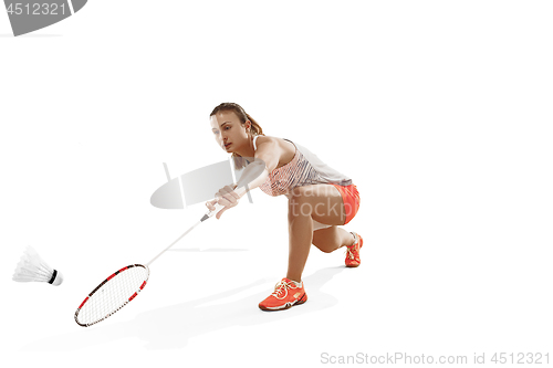 Image of Young woman playing badminton over white background