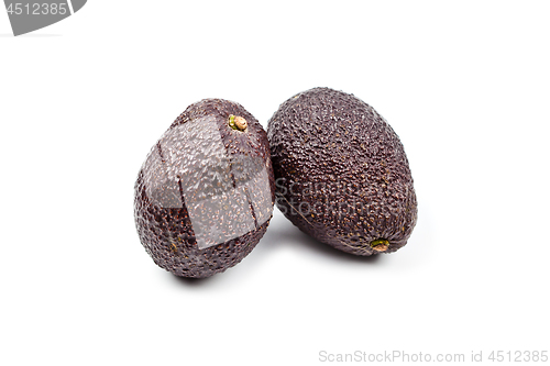 Image of Two fresh organic avocado isolated on white background.