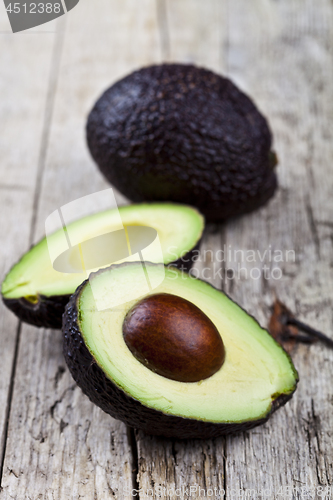 Image of Fresh organic avocado on old wooden table background. Fresh avoc