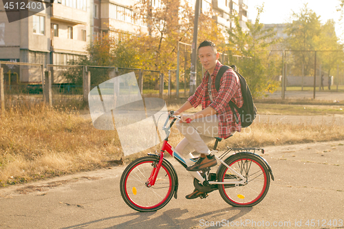 Image of Happy man ride the bicycle