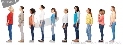 Image of group of happy diverse women standing in line