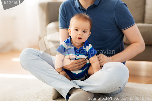 Image of baby boy with father at home