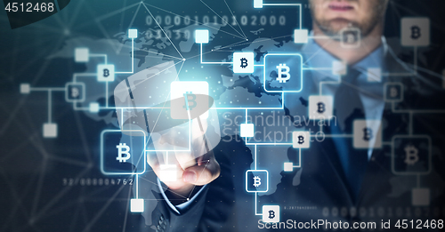 Image of close up of businessman with bitcoin block chain