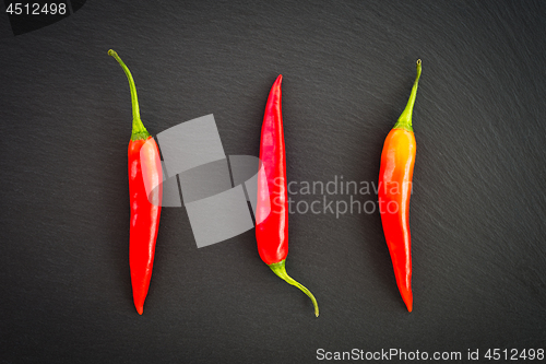 Image of Red hot chili peppers on dark background
