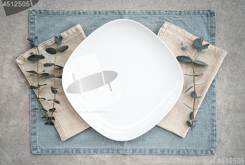 Image of Elegant table setting decorated with eucalyptus branches