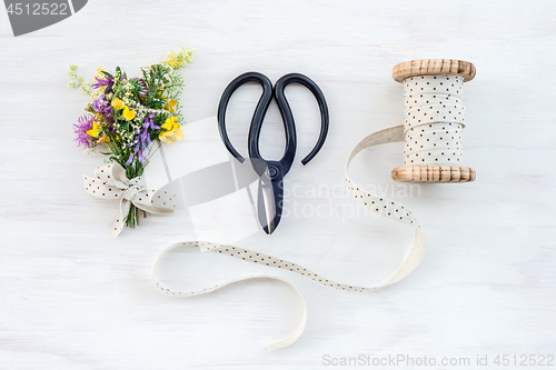 Image of Bouquet of wildflowers decorated with vintage ribbon