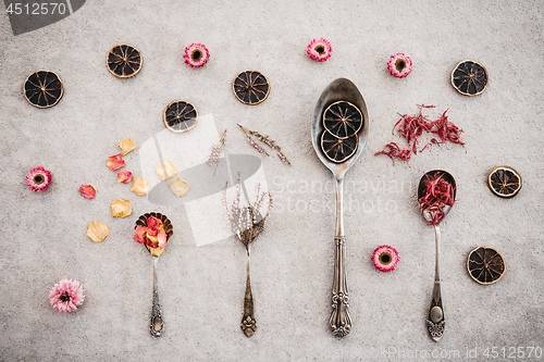Image of Herbs, flowers and vintage silver spoons