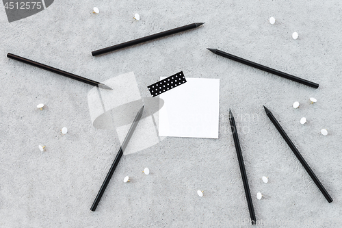 Image of Blank note paper and sharp black pencils