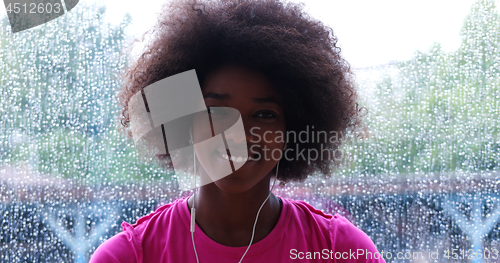 Image of portrait of young afro american woman in gym