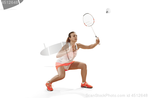 Image of Young woman playing badminton over white background