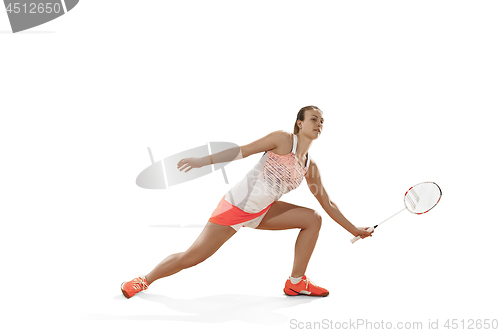 Image of Young woman playing badminton over white background