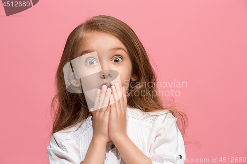 Image of Beautiful teen girl looking suprised isolated on pink