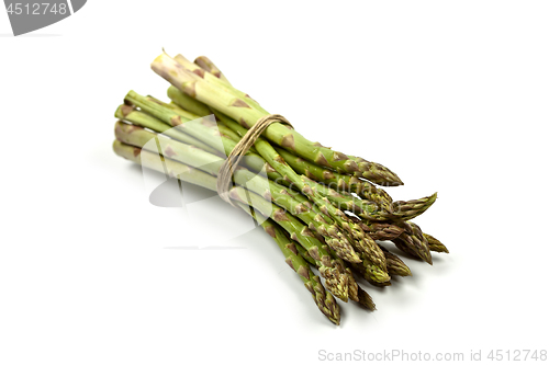 Image of Bunch of fresh raw garden asparagus isolated on white background