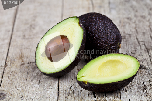 Image of Fresh organic avocado on old wooden table background. Fresh avoc