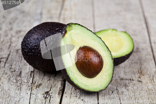 Image of Fresh organic avocado on old wooden table background. Fresh avoc
