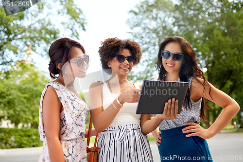 Image of women with tablet pc on street in summer