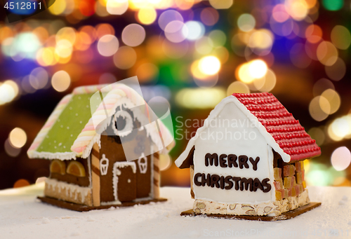 Image of gingerbread houses over christmas lights