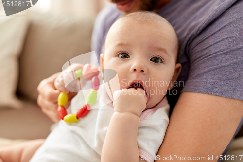 Image of close up of father with little baby girl at home