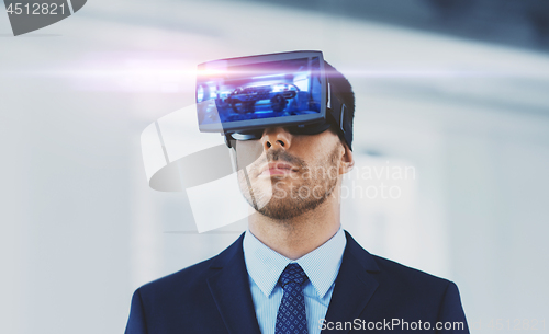 Image of businessman with virtual reality headset at office