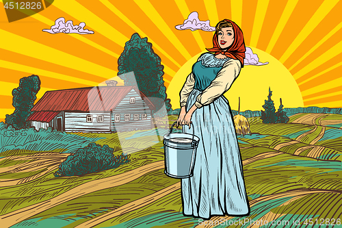 Image of rural woman with a bucket of water or milk. farm landscape