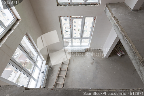 Image of View from the second floor to the first floor in a two-story apartment in a new building