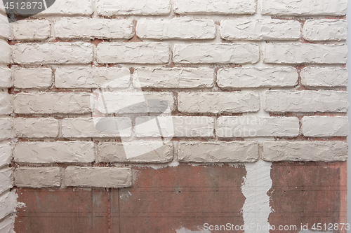 Image of Unfinished imitation of brickwork on the wall