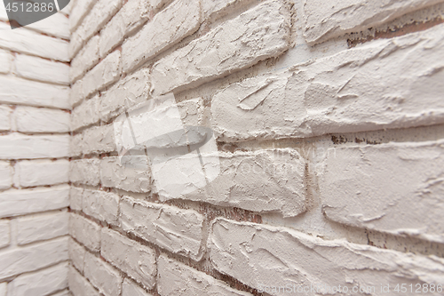 Image of Designer hand-made imitation brickwork on the wall of the apartment