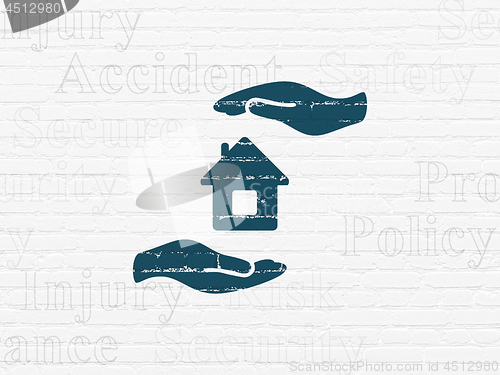 Image of Insurance concept: House And Palm on wall background