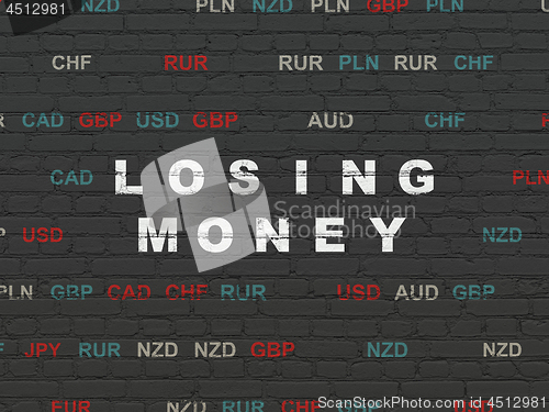 Image of Currency concept: Losing Money on wall background