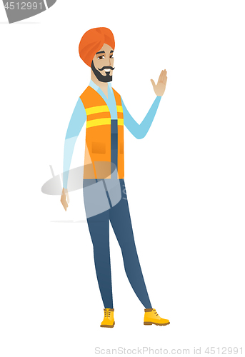 Image of Young hindu builder waving his hand.