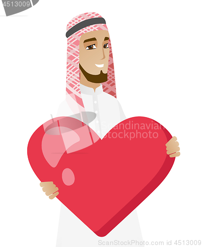 Image of Muslim businessman holding a big red heart.