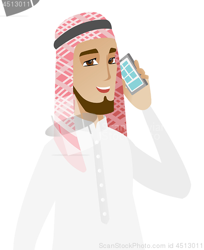 Image of Muslim businessman talking on a mobile phone.