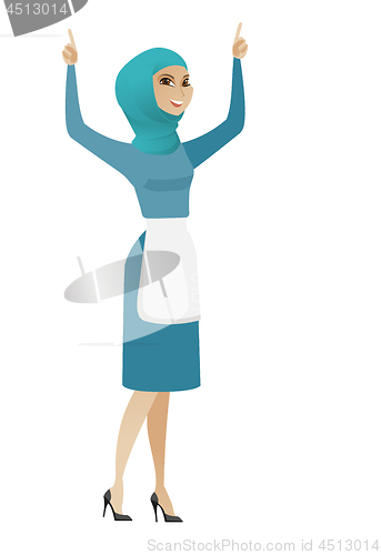 Image of Young muslim cleaner standing with raised arms up.