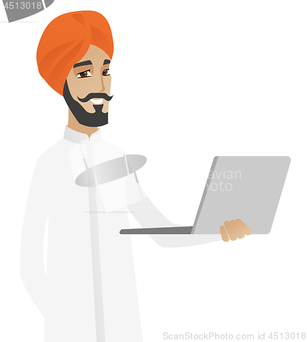 Image of Hindu businessman using laptop.