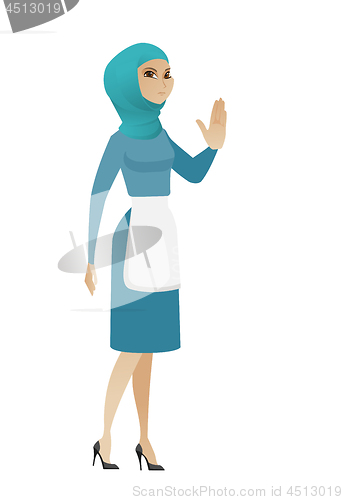 Image of Young muslim cleaner showing palm hand.