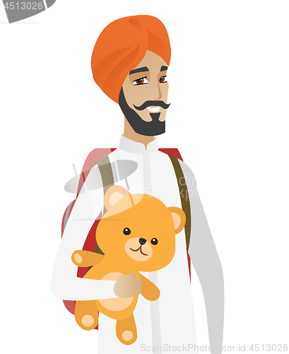 Image of Hindu traveler man holding teddy bear.