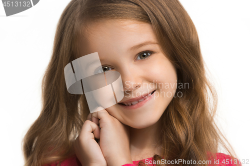 Image of The happy teen girl standing and smiling against white background.