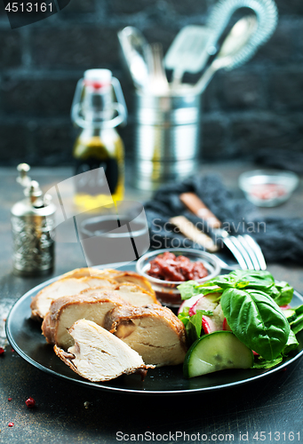 Image of meat with salad