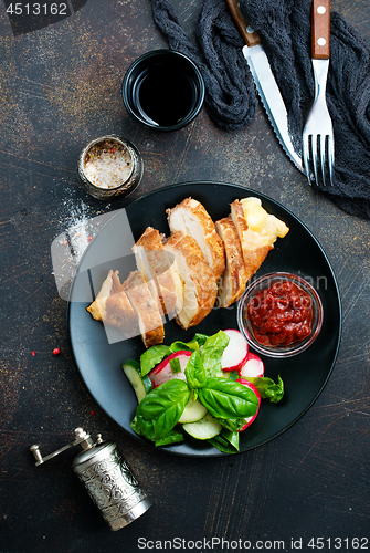 Image of meat with salad