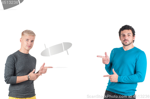 Image of Two handsome guys showing somewhere with fingers